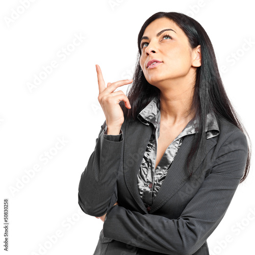 Photo: Thoughtful woman looking up Thoughtful woman looking up