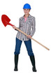 Tradeswoman holding a spade
