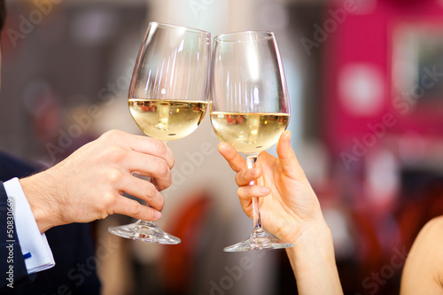 Photo: Couple toasting wine Couple toasting wine