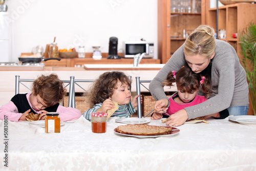 Photo: Young children eating crepes Young children eating crepes