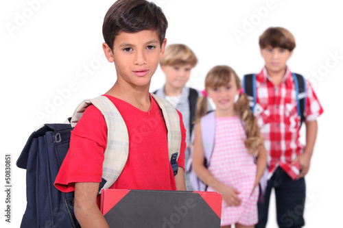 Photo: Four young schoolchildren Four young schoolchildren