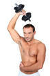 bare-chested man muscular man doing fitness with dumbbell
