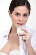 Woman drinking a glass of milk