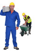 Builders with grey concrete blocks