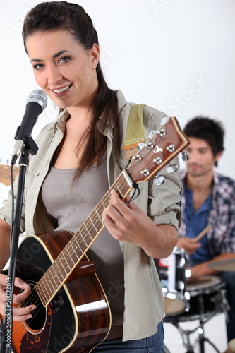 Photo: Woman with acoustic guitar Woman with acoustic guitar