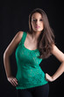 Beautiful brunette woman portrait on black background.