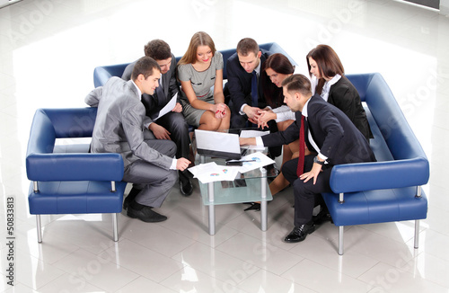 Photo: Top view of working business group during meeting Top view of working business group during meeting