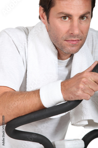 Photo: Man exercising at gym Man exercising at gym