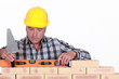 craftsman working with a level