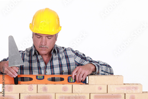 Photo: craftsman working with a level craftsman working with a level