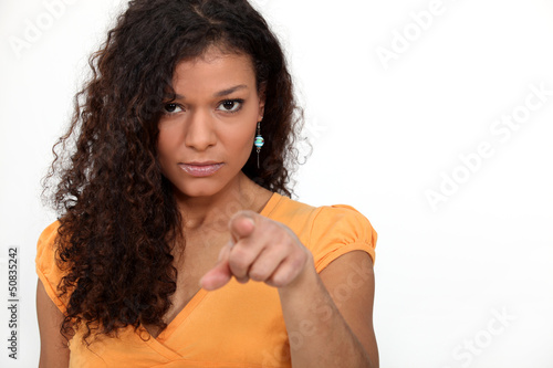 Photo: Women with curly hair pointing Women with curly hair pointing