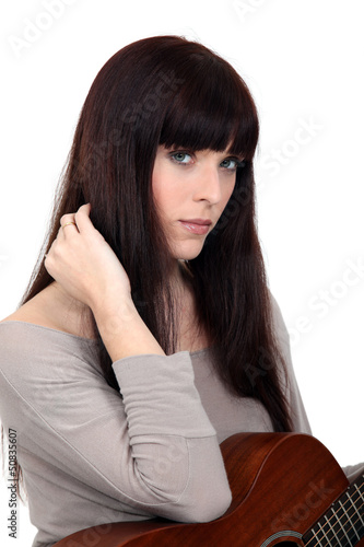 Photo: Brunette woman with guitar Brunette woman with guitar
