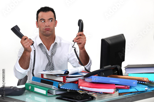 Photo: overworked businessman overworked businessman