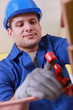 Tradesman using a tool