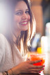 Woman holding a cocktail