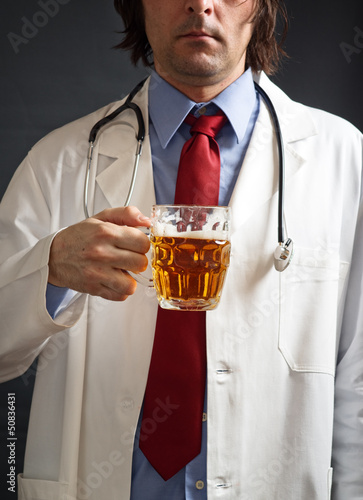 Photo: Doctor is drinking beer Doctor is drinking beer