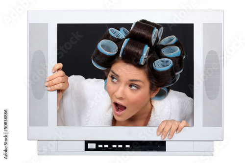 Photo: Woman escaping from television set Woman escaping from television set