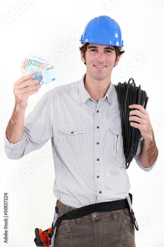 Photo: Electrician making savings Electrician making savings