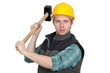 A manual worker with a sledgehammer.