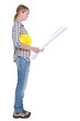 Female construction worker stood reading plans