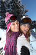 Two female friends in the snow