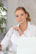 A secretary in front of her laptop