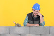 Mason supported by concrete wall