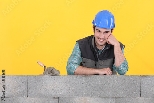 Photo: Mason supported by concrete wall Mason supported by concrete wall