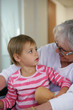 Photo: Old lady playing with granddaughter Old lady playing with granddaughter