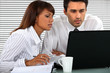 Young business couple hard at work