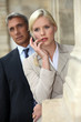 Woman with a cellphone and her older partner