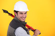 Man resting large bolt cutters over shoulder