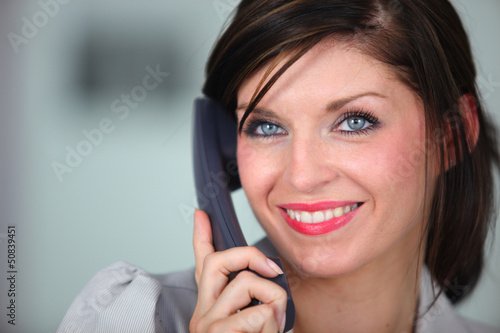 Photo: Friendly brunette receptionist Friendly brunette receptionist