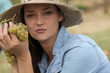 Woman holding grapes