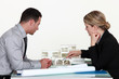 Architects evaluating a building model