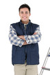 Photo: craftsman standing cross-armed in studio with ladder and tools craftsman standing cross-armed in studio with ladder and tools