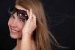 Woman wearing sunglasses on a breezy day