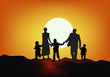 family silhouette at sunset