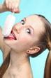 Foto: Young woman with ice cream Young woman with ice cream