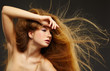 long-haired curly red-haired woman