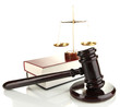 Golden scales of justice, gavel and books isolated on white