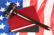 Judge gavel and books on american flag background