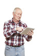 Senior man using tablet computer looking confused