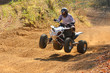 Quad motorbike rider jumps