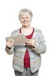Senior woman using tablet computer smiling