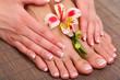 Beautiful woman legs and hands on bamboo mat