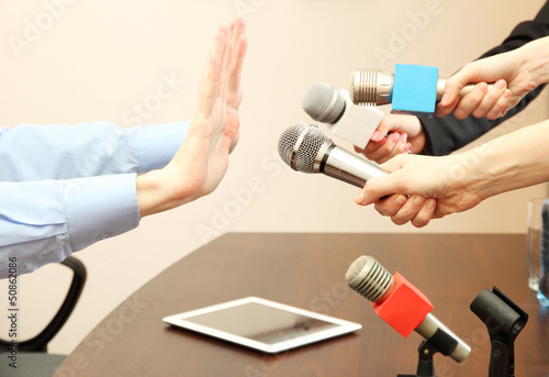 Photo: Conceptual photo of businessman or politician giving no Conceptual photo of businessman or politician giving no