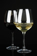 Two glasses of  red and white wine, isolated on black