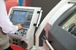 man working at programmable machine