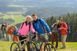 Sporty cyclist couple hikers springtime weekend